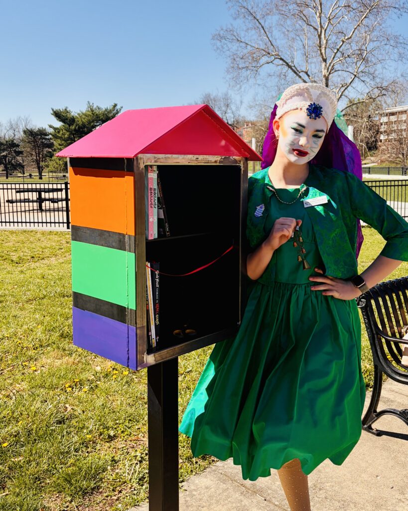 A Sister beside the colorful book house dedicated by the City of Fountains Sisters, Easter 2026